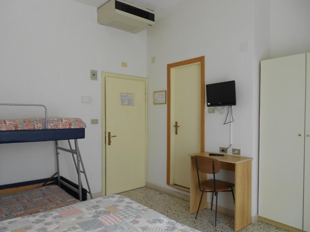 Postel nebo postele na pokoji v ubytování Hotel Laguna Blu