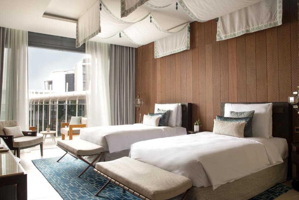 Voodi või voodid majutusasutuse Jumeirah Saadiyat Island Abu Dhabi toas