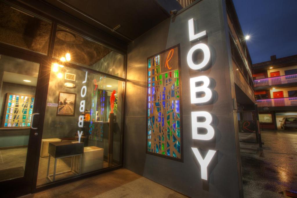 a store front with a neon sign and a window at Hotel Ruby in Spokane