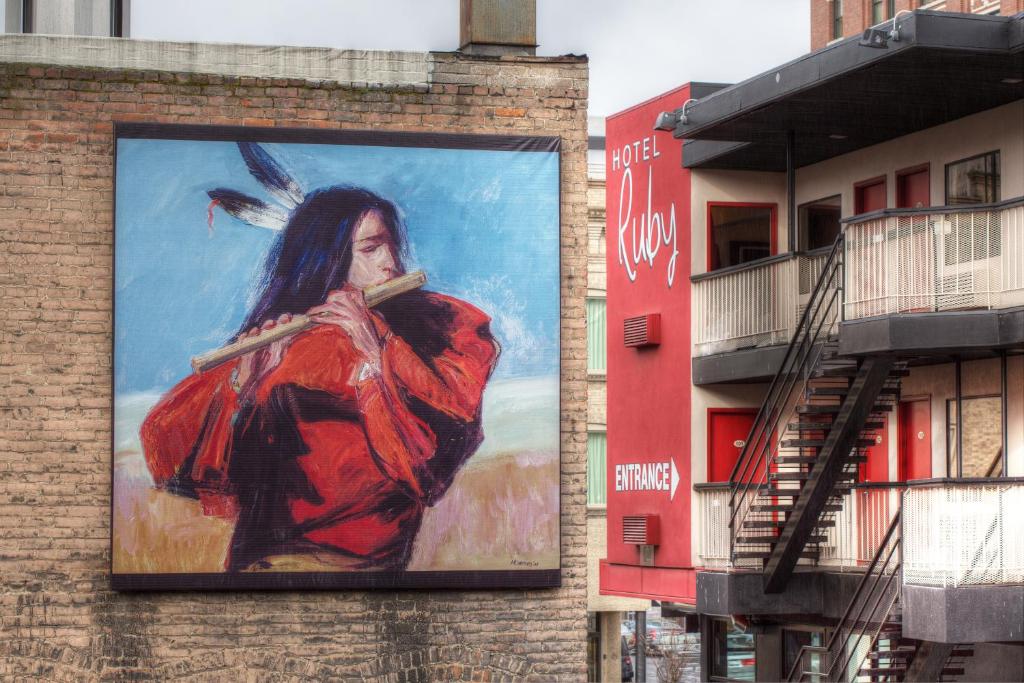 a large painting on the side of a building at Hotel Ruby in Spokane