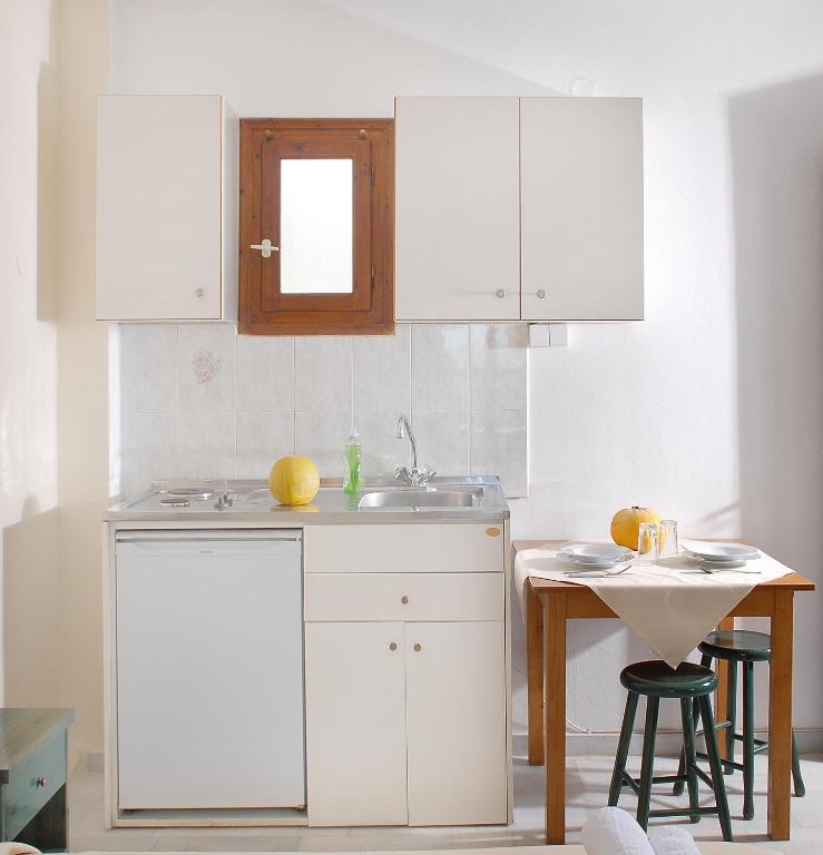 Kuchyň nebo kuchyňský kout v ubytování Bluefox Apartments