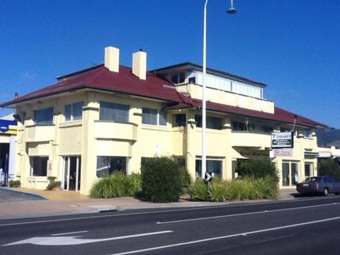 a large white building on the side of a street at Stella's Dromana Hotel in Dromana