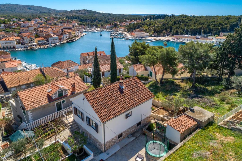 a house with a view of a river and a city at SeaView Apartment Toni in Milna