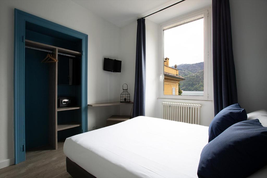 Postel nebo postele na pokoji v ubytování Hotel Orso Bruno