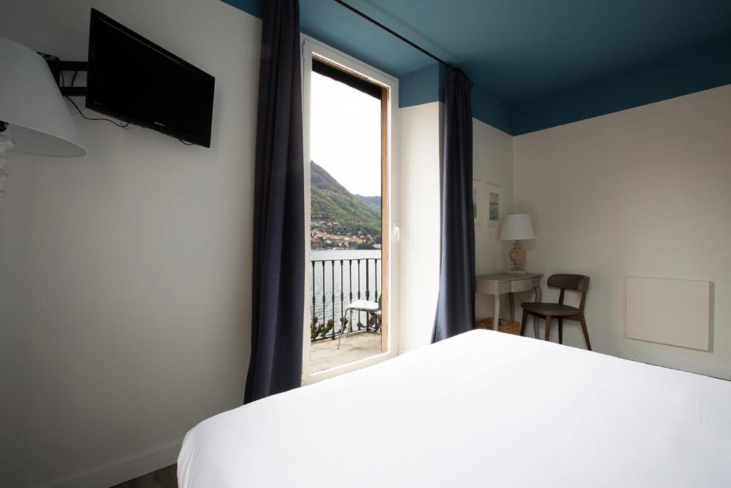 Postel nebo postele na pokoji v ubytování Hotel Orso Bruno