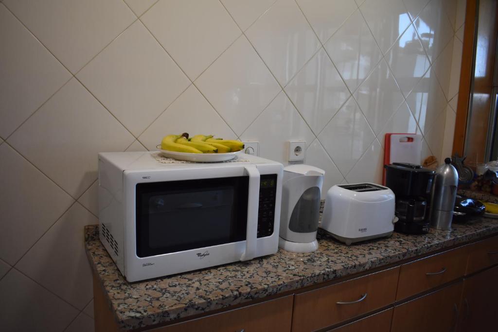 Η κουζίνα ή μικρή κουζίνα στο Rooms São Dinis