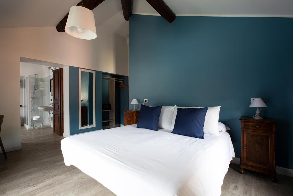 Postel nebo postele na pokoji v ubytování Hotel Orso Bruno