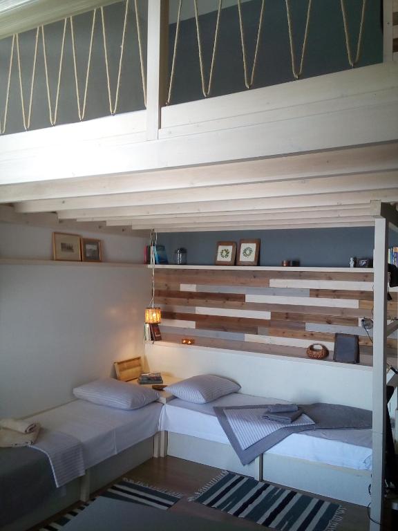 Postel nebo postele na pokoji v ubytování Plori House
