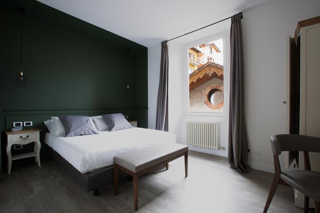 Postel nebo postele na pokoji v ubytování Hotel Orso Bruno