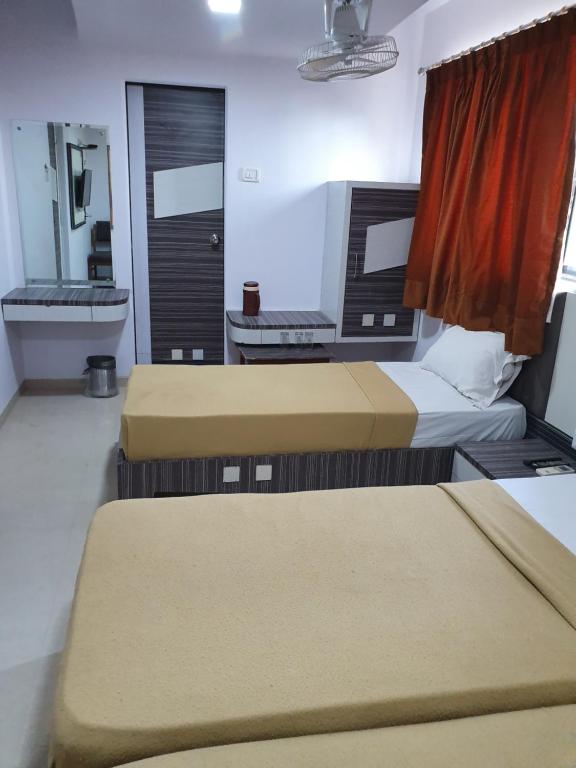 Postel nebo postele na pokoji v ubytování Hotel Apex
