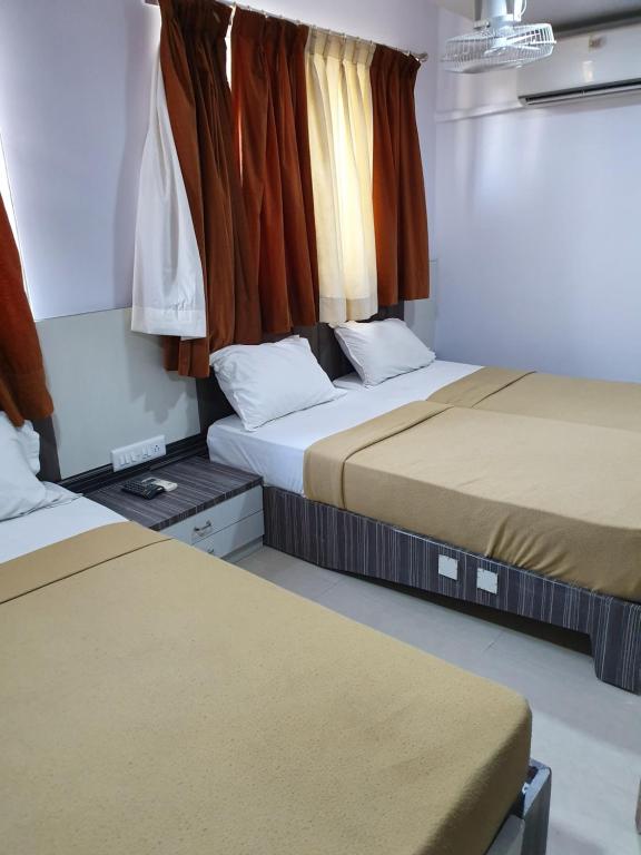 Postel nebo postele na pokoji v ubytování Hotel Apex