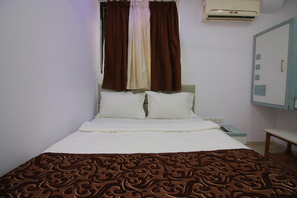 Postel nebo postele na pokoji v ubytování Hotel Apex