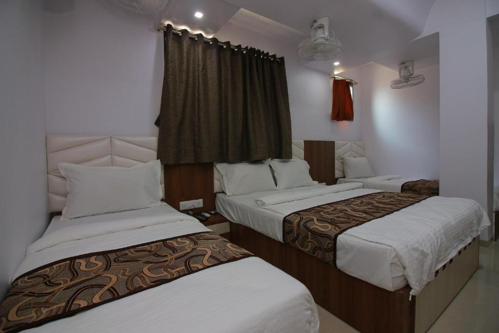 Postel nebo postele na pokoji v ubytování Hotel Apex