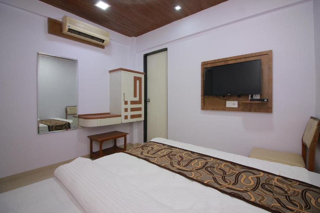 Postel nebo postele na pokoji v ubytování Hotel Apex