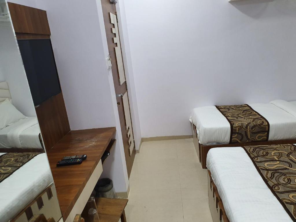 Postel nebo postele na pokoji v ubytování Hotel Apex