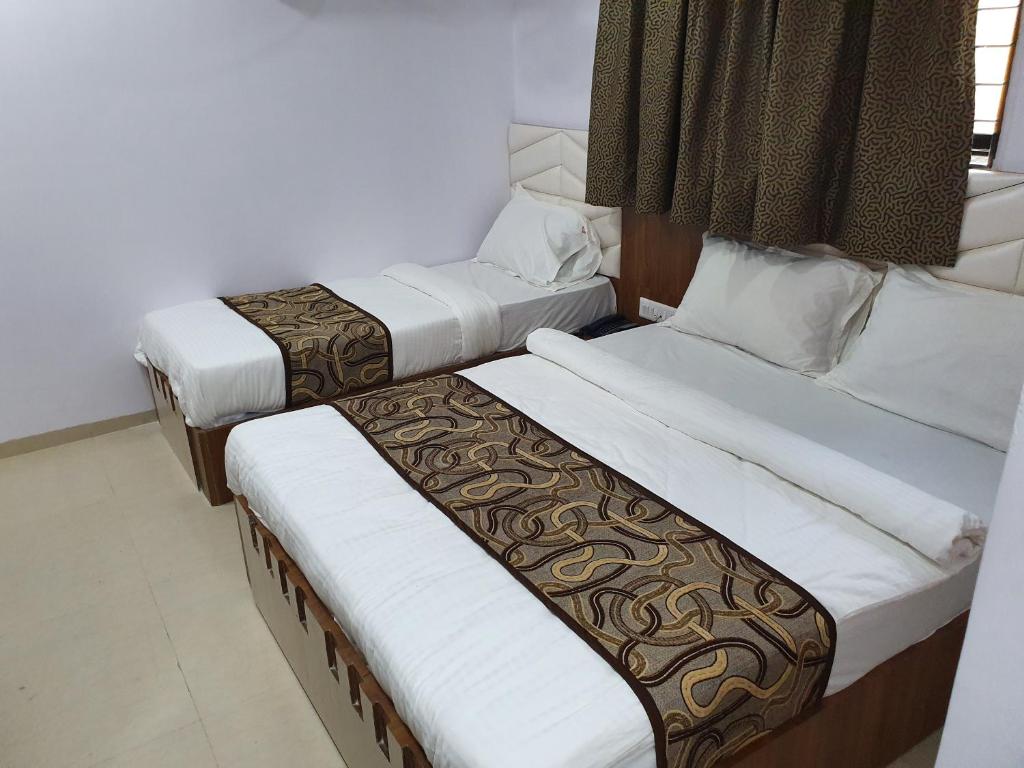 Postel nebo postele na pokoji v ubytování Hotel Apex