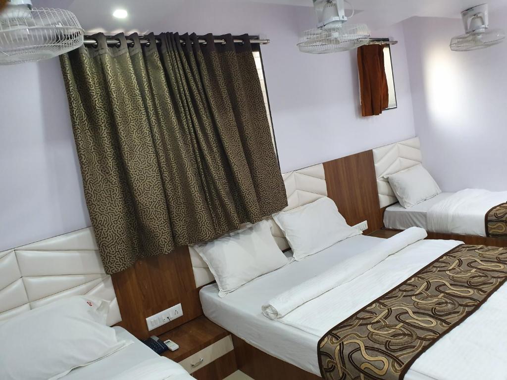 Postel nebo postele na pokoji v ubytování Hotel Apex