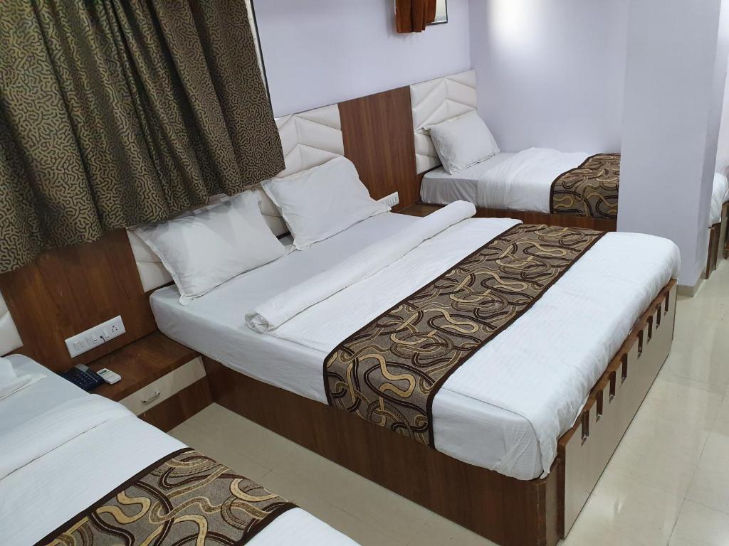 Postel nebo postele na pokoji v ubytování Hotel Apex