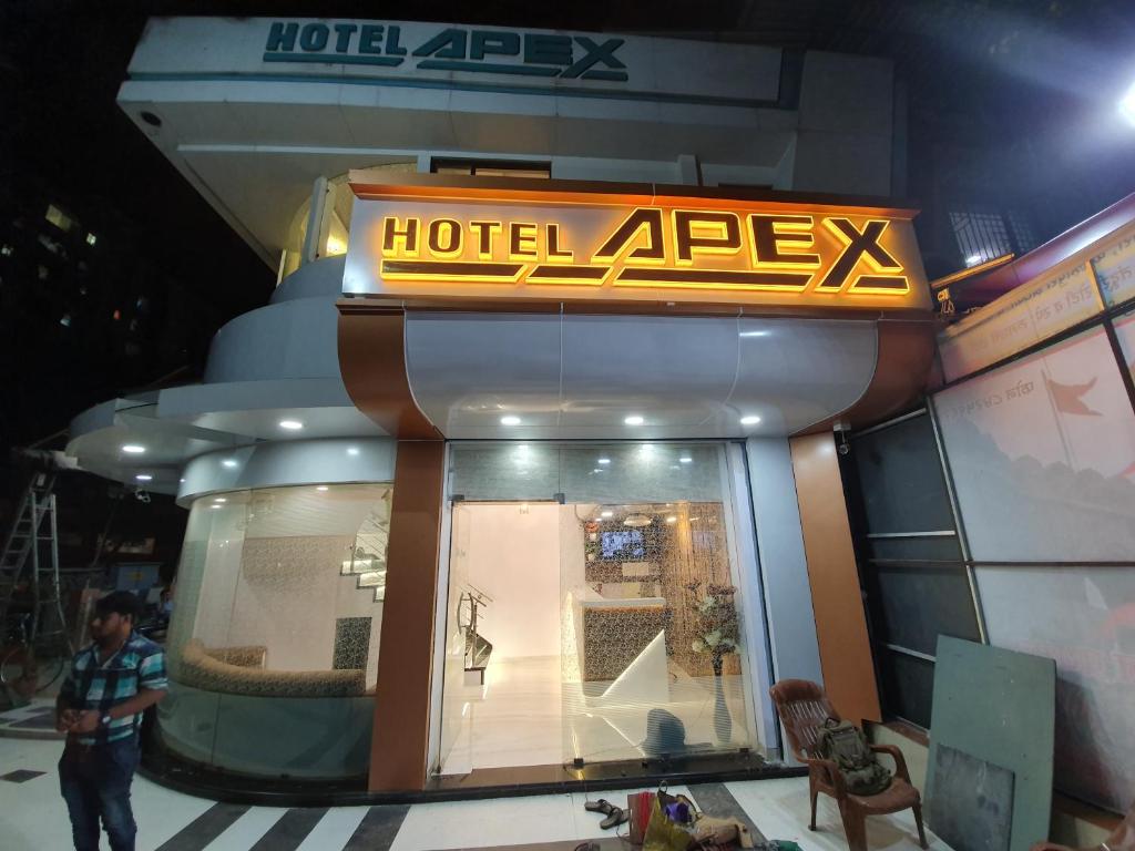 a hotel alex sign in front of a store at Hotel Apex in Navi Mumbai