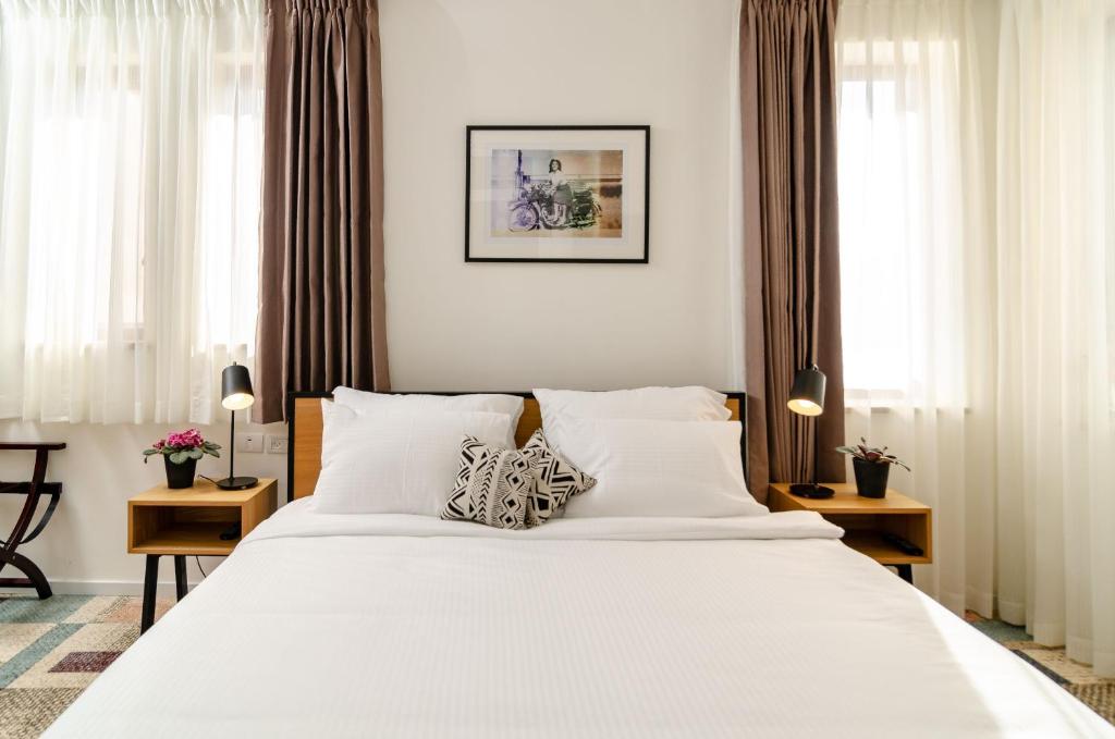 Postel nebo postele na pokoji v ubytování Biazi Hotel