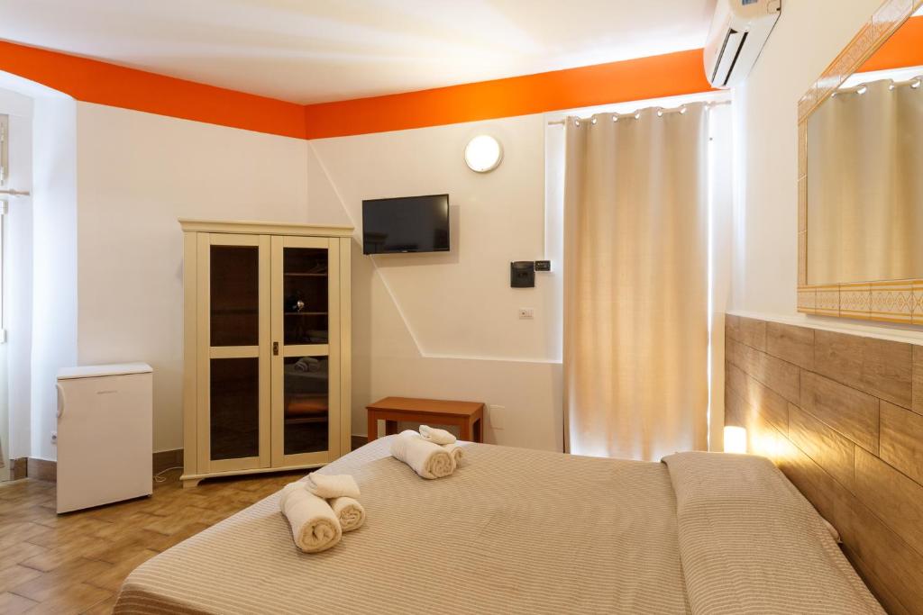 Postel nebo postele na pokoji v ubytování Agriturismo Il Gelsomino Ritrovato