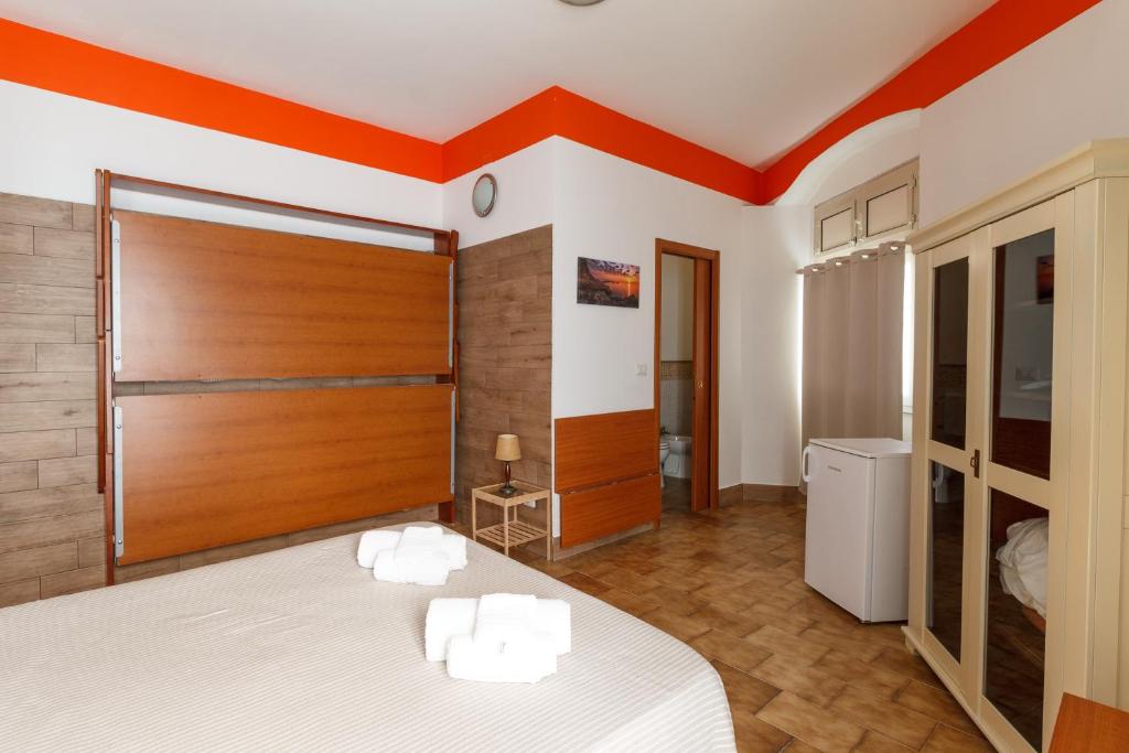 Postel nebo postele na pokoji v ubytování Agriturismo Il Gelsomino Ritrovato