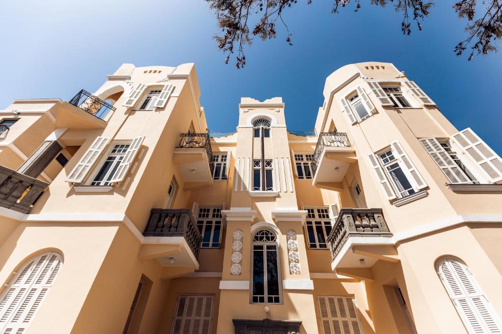 een afbeelding van een gebouw met balkons bij House of Palm - One of a Kind in Tel Aviv