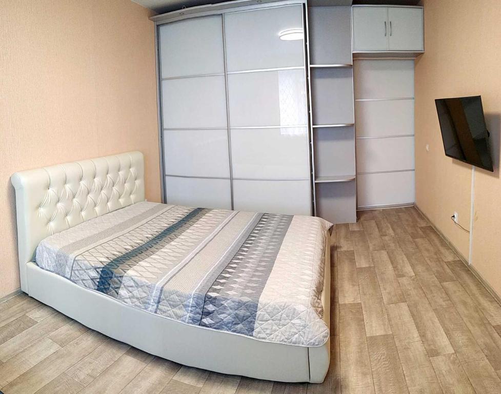 Uma cama ou camas num quarto em Солнечный проезд 25 Аквапарк Источники