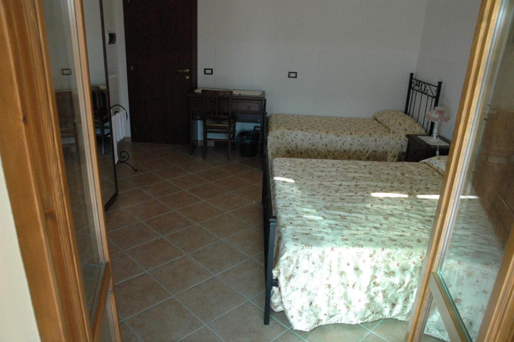 Letto o letti in una camera di Affittacamere La Sosta
