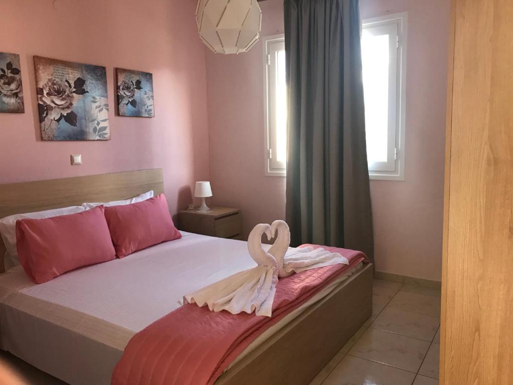 Postel nebo postele na pokoji v ubytování Omega Comfy Apartments