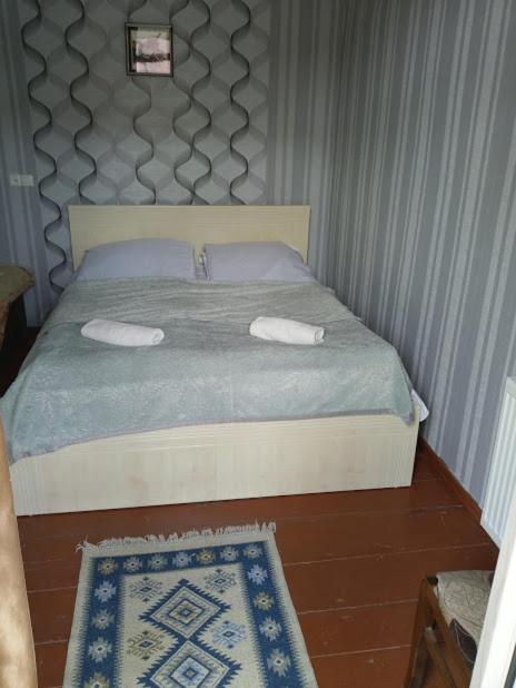 Postel nebo postele na pokoji v ubytování Abramichi Guest House