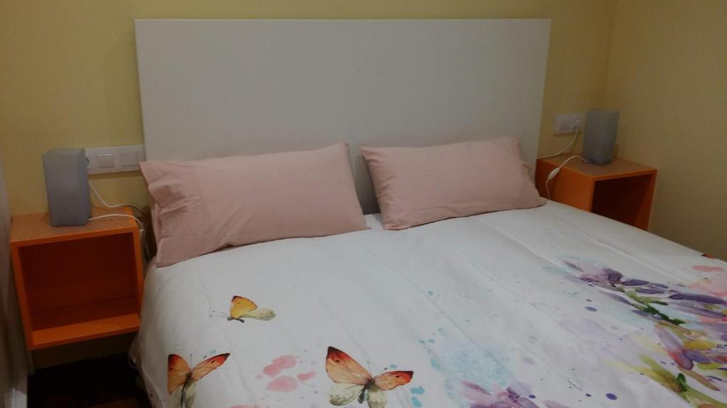 Posteľ alebo postele v izbe v ubytovaní Apartamentos Ferrán Paqui