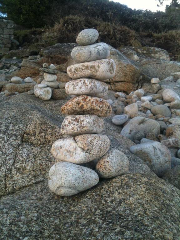 a group of rocks stacked on top of each other at Les jardins du vivier in Combrit