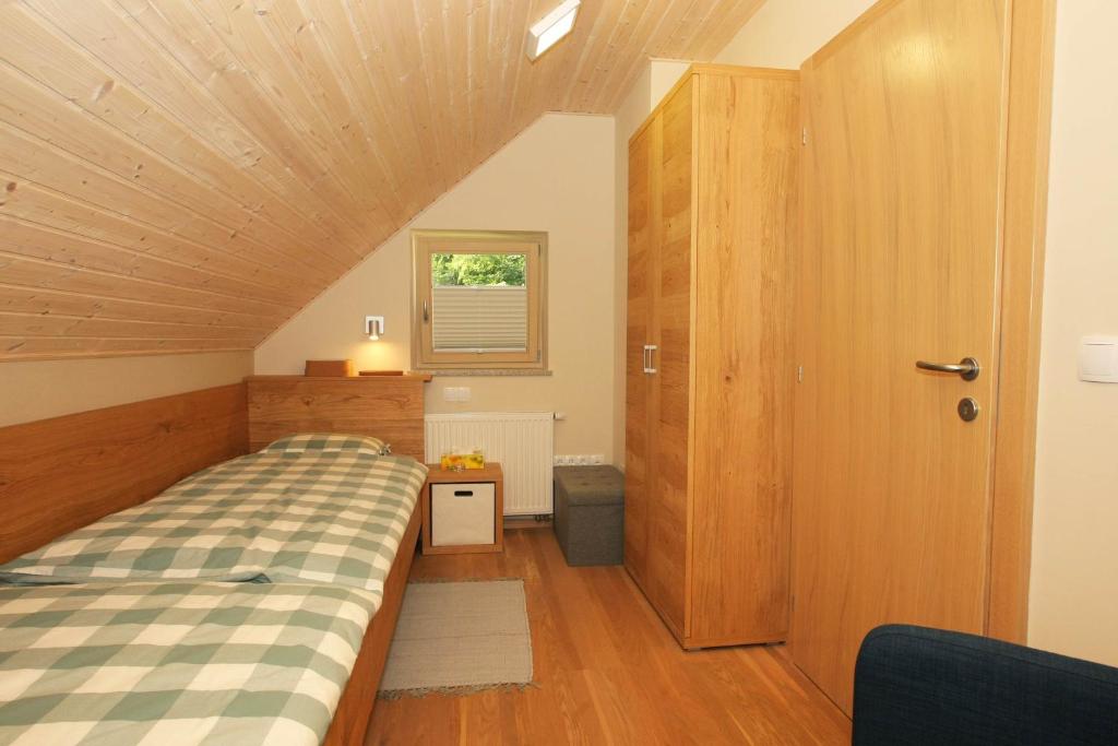 Postel nebo postele na pokoji v ubytování Apartma - Počitniška hiša Lodi