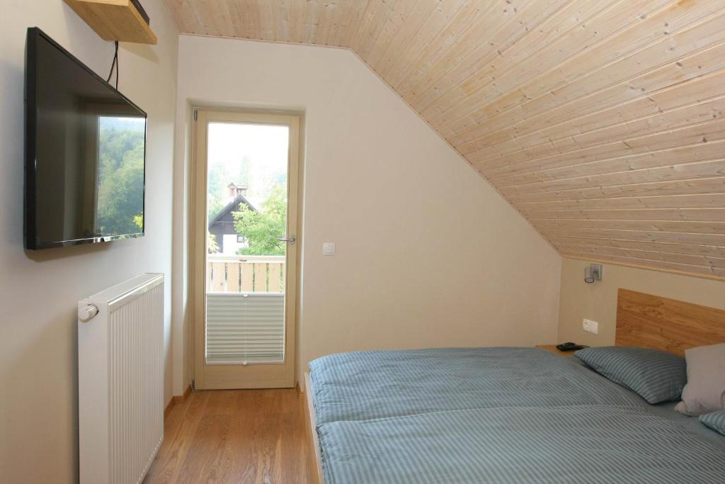 Postel nebo postele na pokoji v ubytování Apartma - Počitniška hiša Lodi