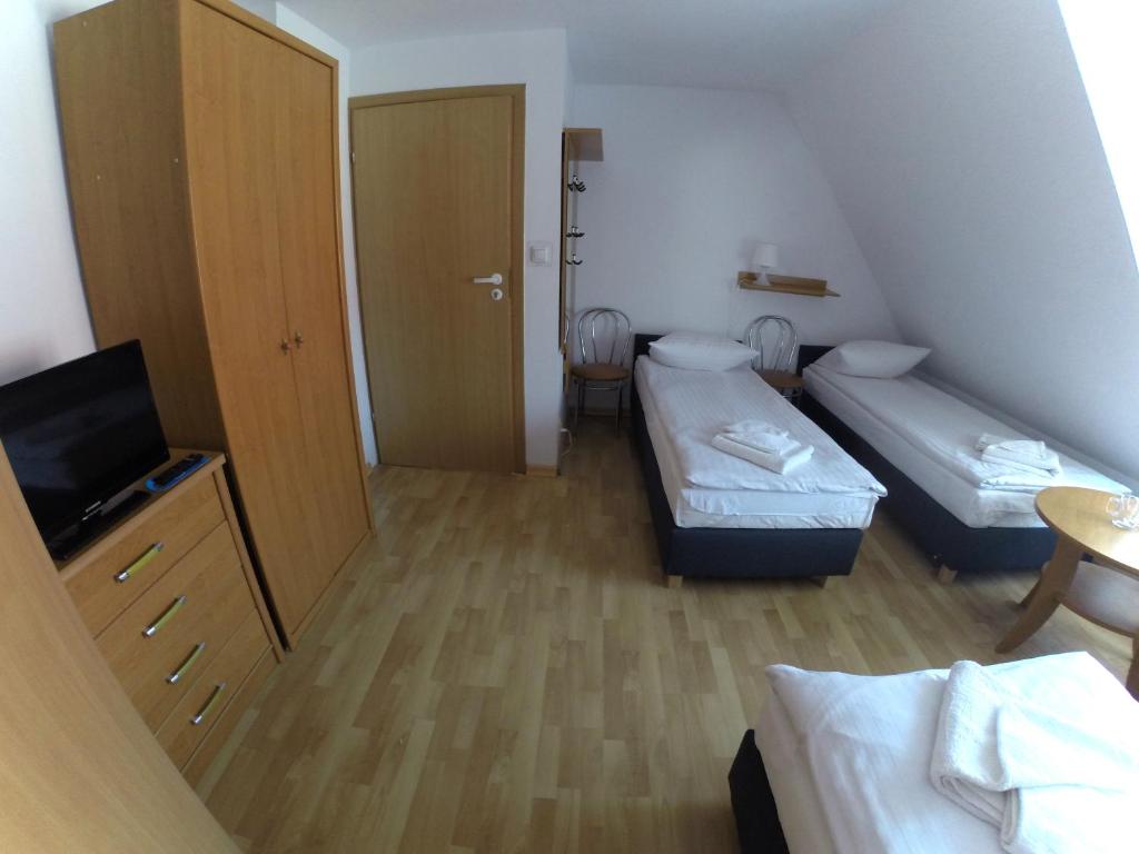 Postel nebo postele na pokoji v ubytování Ośrodek Wypoczynkowy Merkury