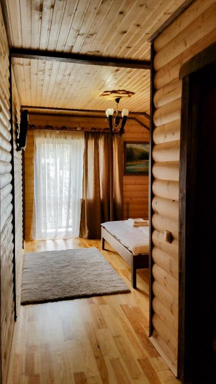 Postel nebo postele na pokoji v ubytování Коло Гір