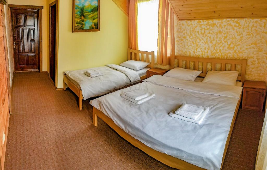 Postel nebo postele na pokoji v ubytování Коло Гір
