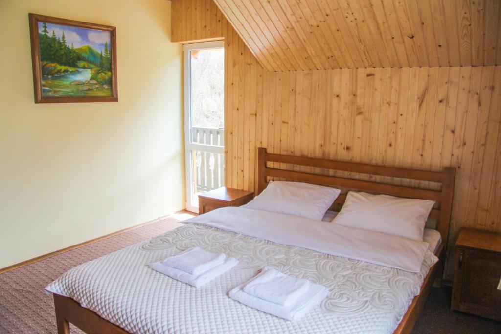 Postel nebo postele na pokoji v ubytování Коло Гір