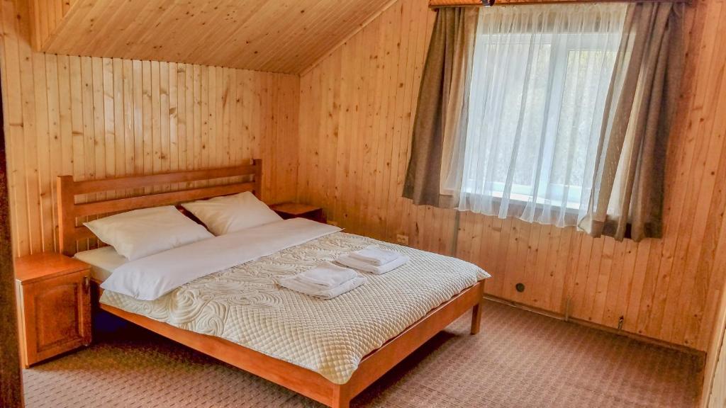 Postel nebo postele na pokoji v ubytování Коло Гір