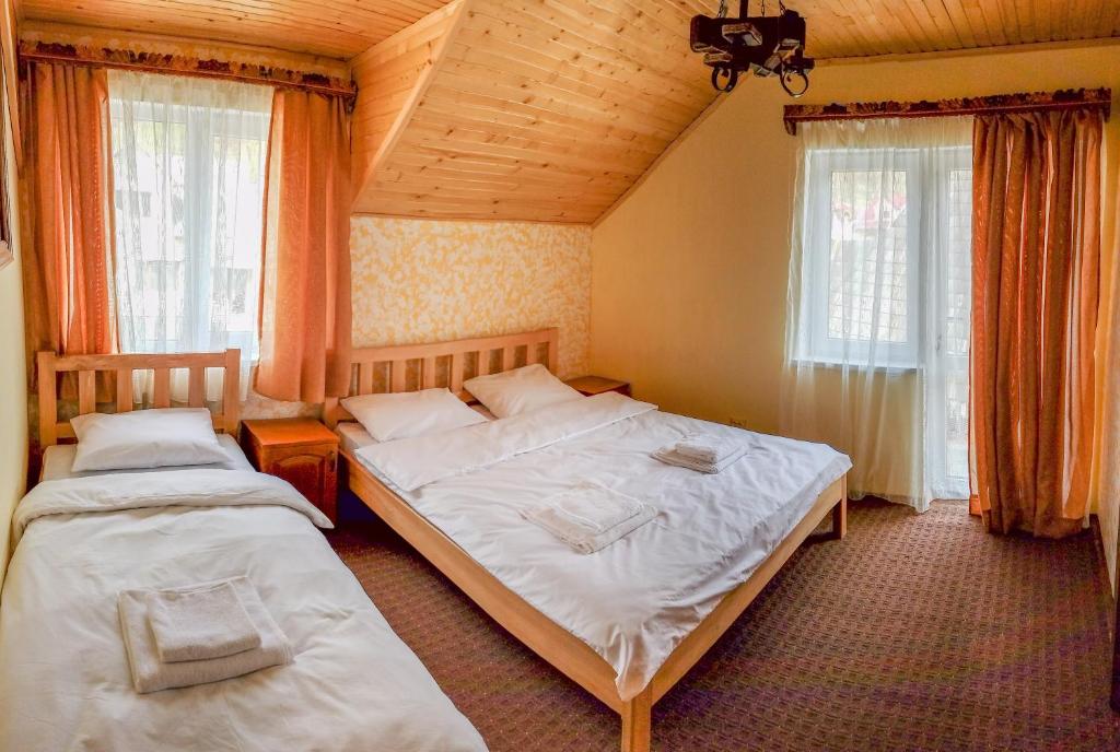 Postel nebo postele na pokoji v ubytování Коло Гір