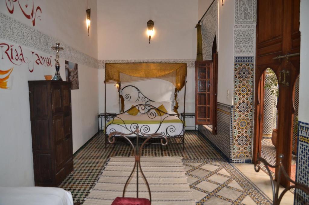 Postel nebo postele na pokoji v ubytování Riad Jamaï