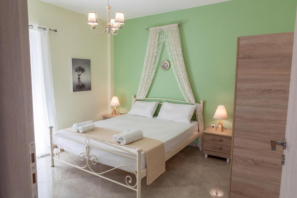 Posteľ alebo postele v izbe v ubytovaní John Apartments