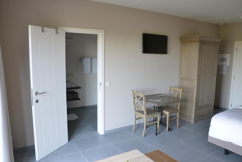 Postel nebo postele na pokoji v ubytování B&B Nieuwhof