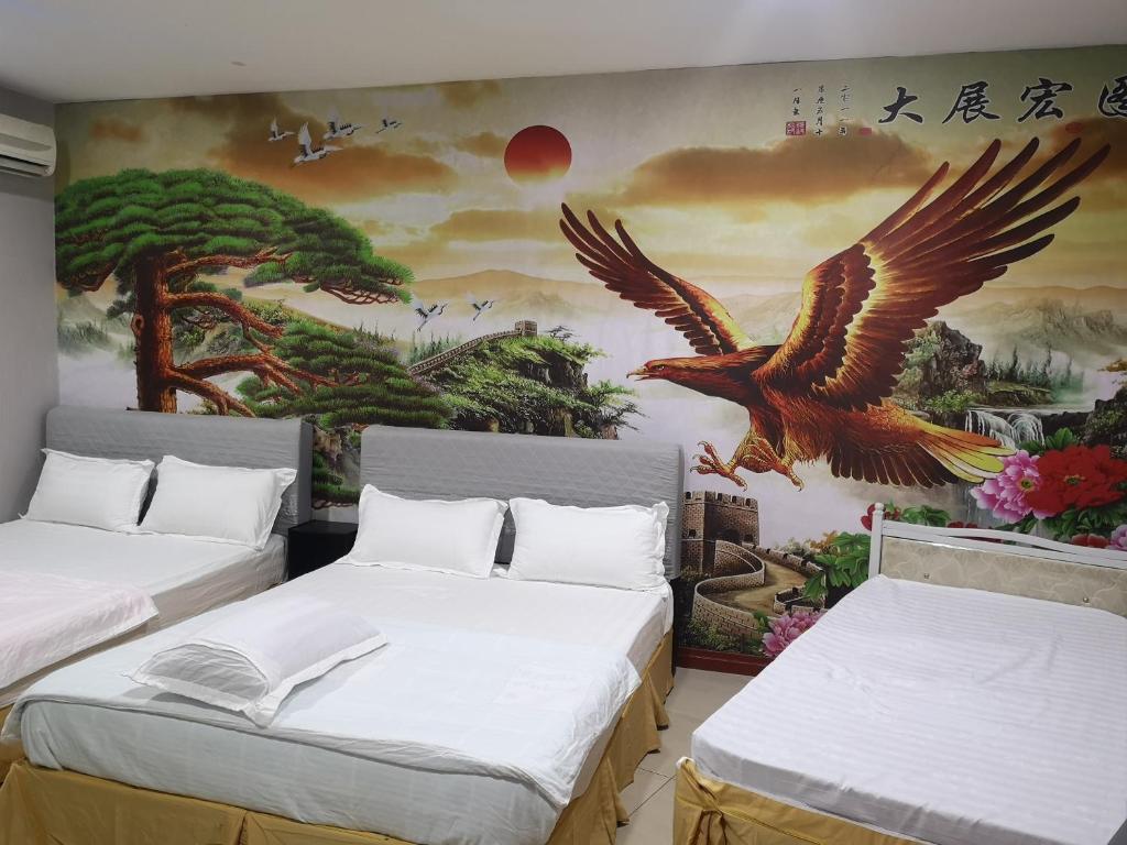 Postel nebo postele na pokoji v ubytování Home Inn Hotel