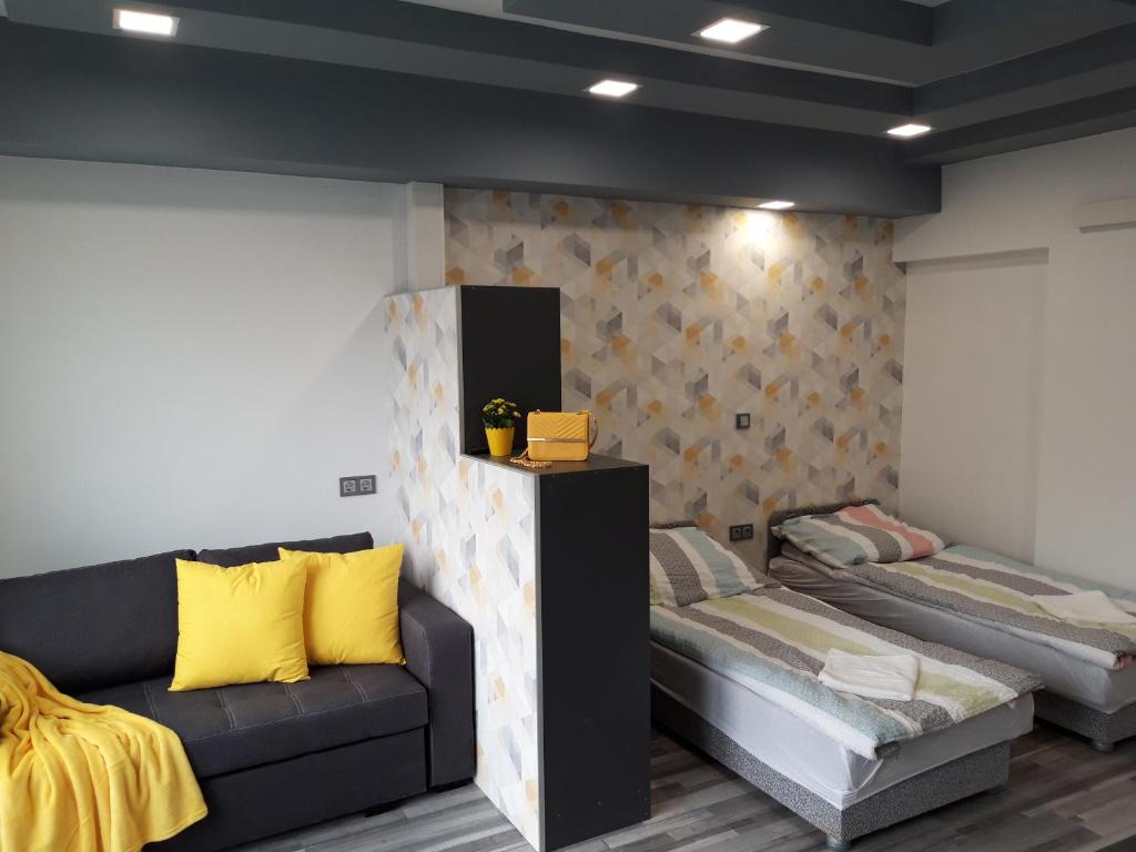 A bed or beds in a room at Belvárosi apartman