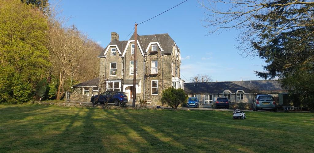 a large house with a large yard in front of it at Trem Hyfryd B&B in Dolgellau
