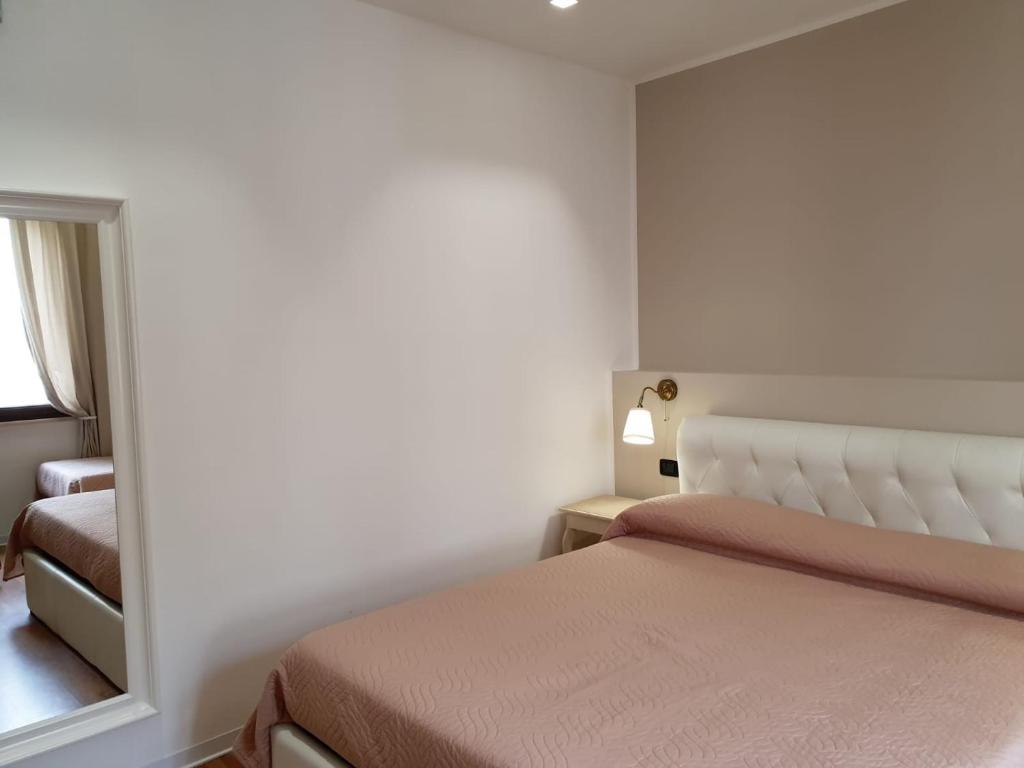 Postel nebo postele na pokoji v ubytování Guest House Piazza Carmine