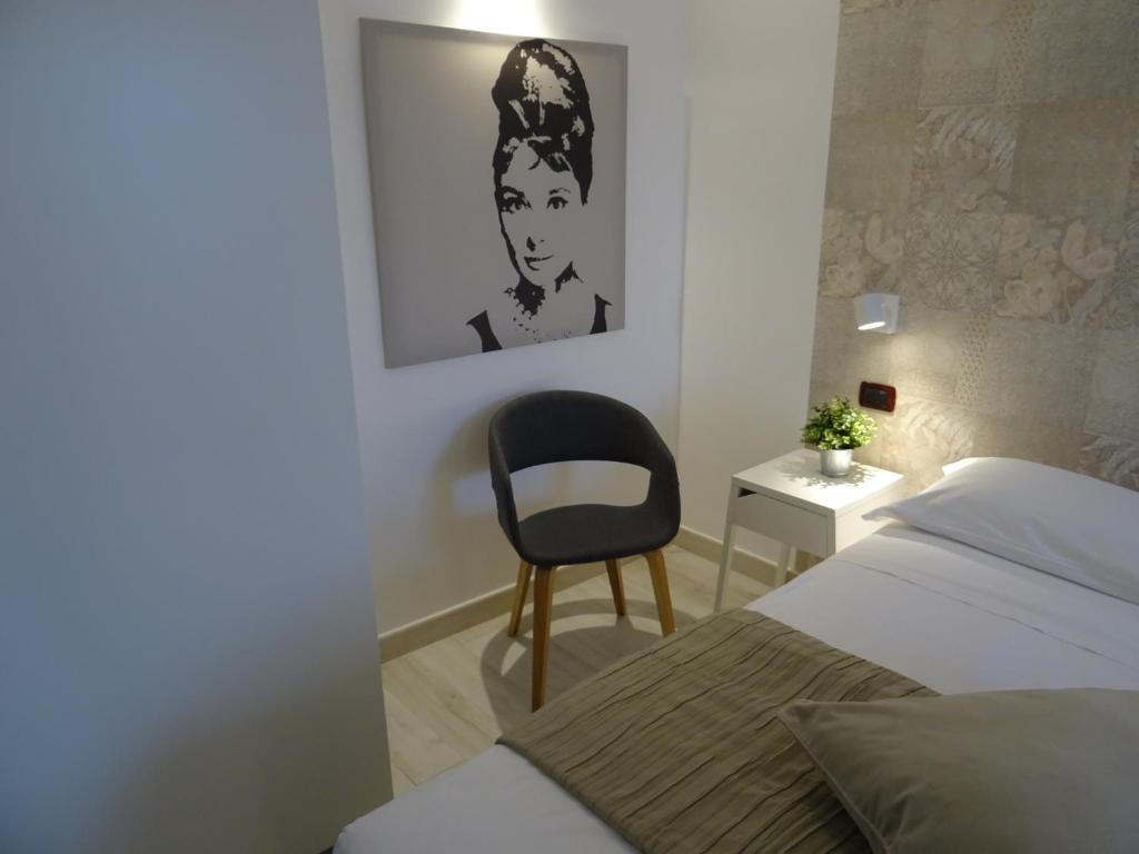 Postel nebo postele na pokoji v ubytování Holiday Rooms Portale Pirrera