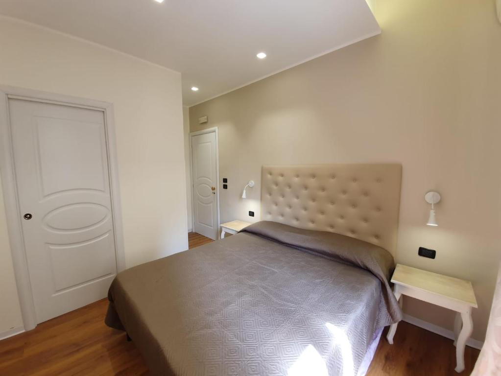 Postel nebo postele na pokoji v ubytování Guest House Piazza Carmine